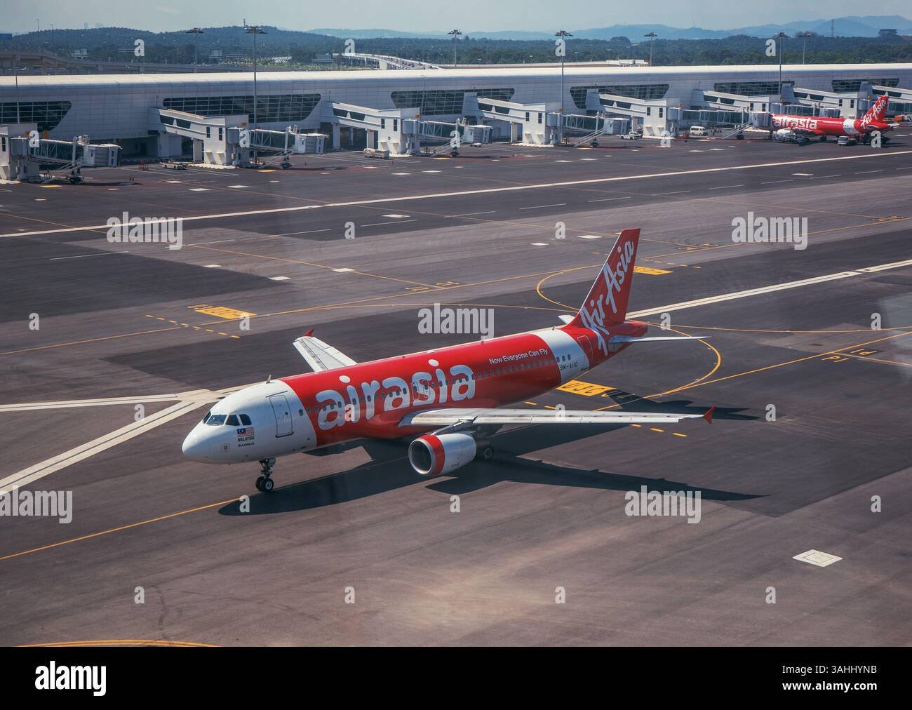 AirAsia Airbus A320 Aircraft Taxiing at Kuala Lumpur International Airport (KLIA) – Modern Aviation and Low-Cost Airline Travel in Malaysia